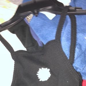 Black ribbed tank—has a daisy on front